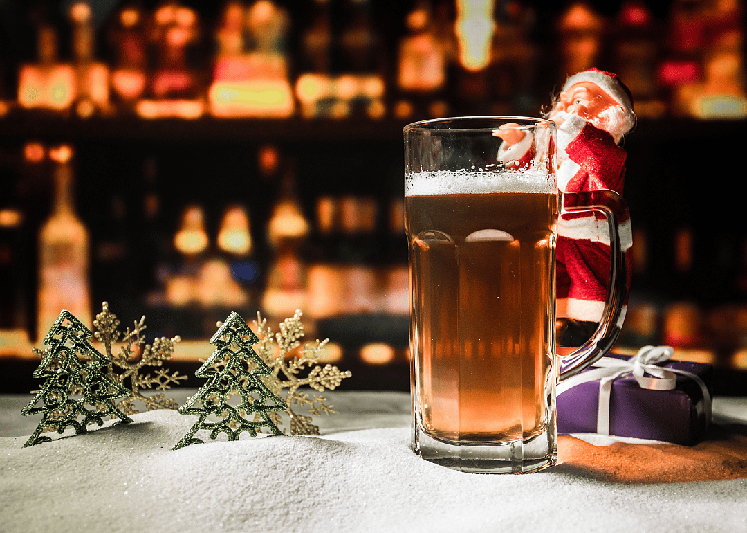 Christmas decor and beer glass in bar.