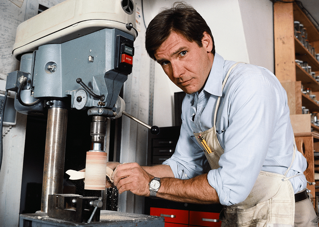 Harrison Ford poses with a table saw at his home