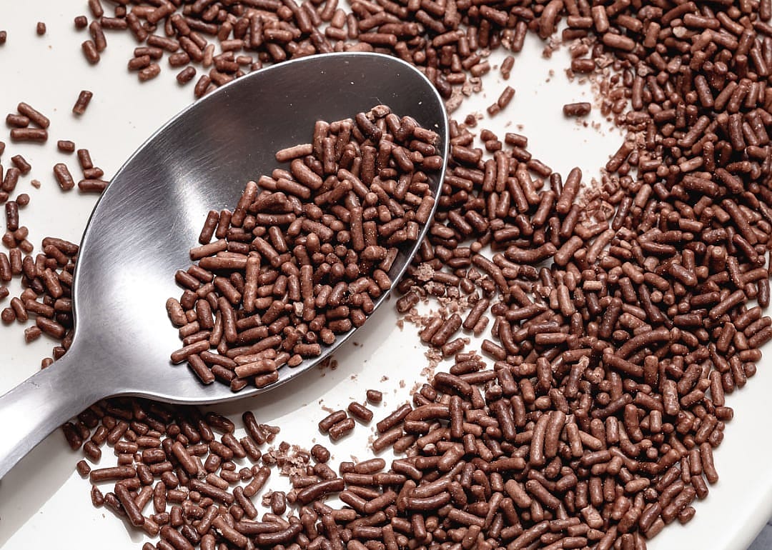 Spoon with chocolate sprinkles.