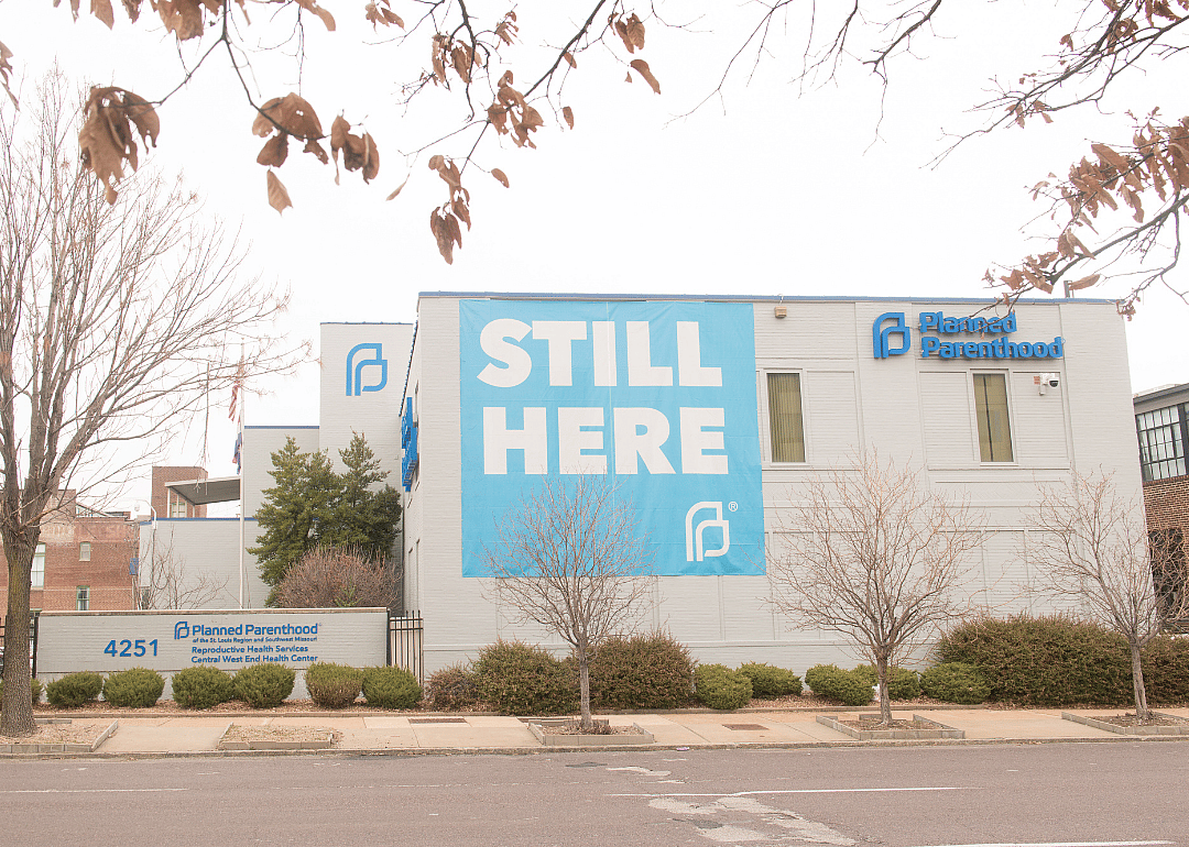Exterior of Missouri Planned Parenthood building with a large ‘Still Here’ banner