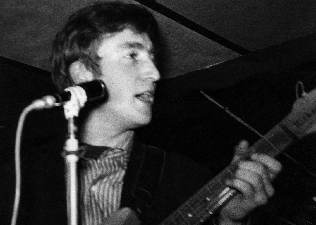 Close up John Lennon playing guitar at the Cavern Club.