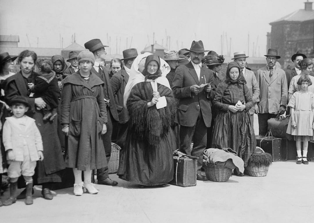 Immigrants arriving at Ellis Island.