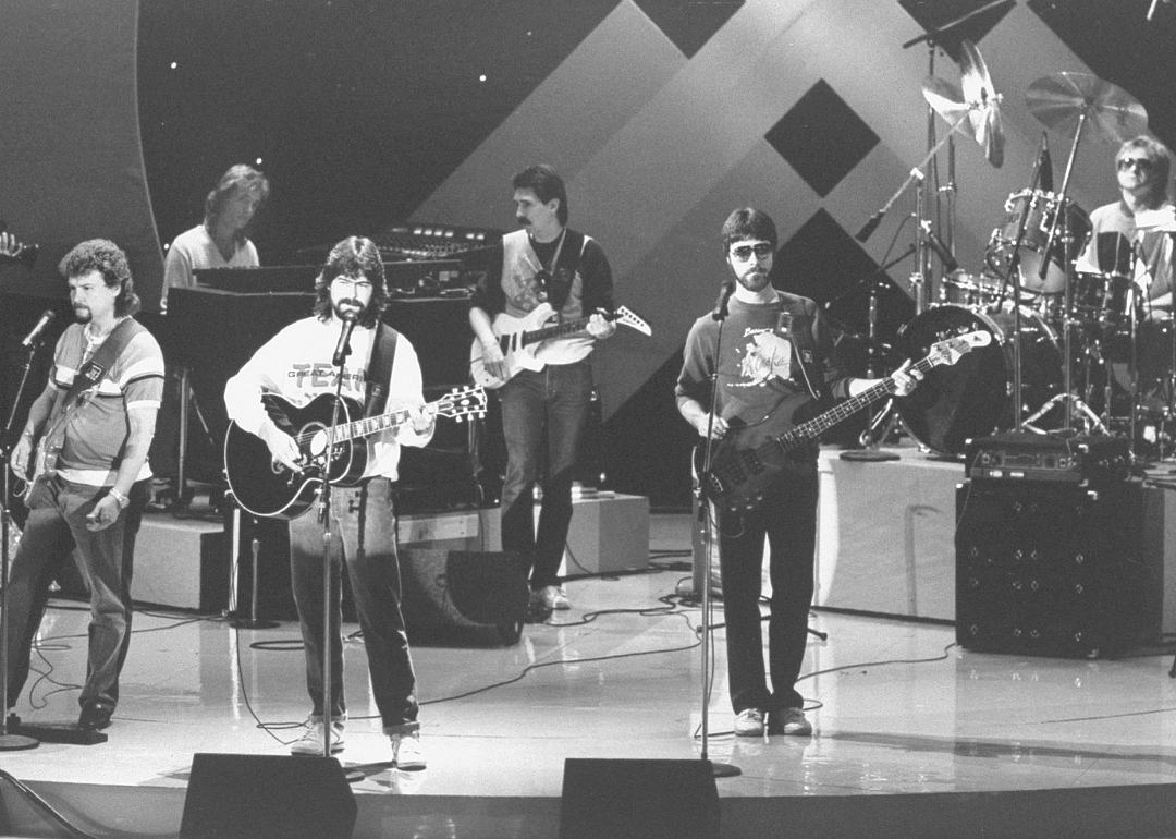 Musical group Alabama performs onstage.