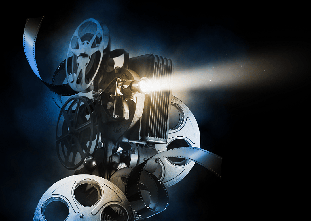 Movie projector against black background.
