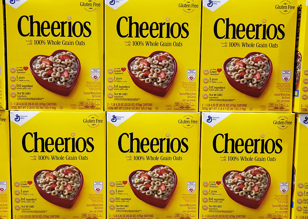 Stacked boxes of Cheerios cereal.