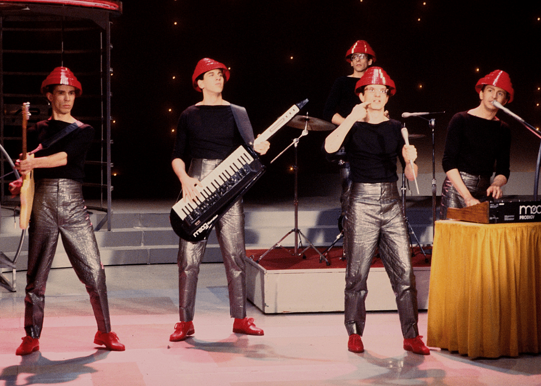 Devo performing onstage.