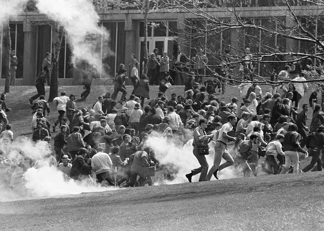 Demonstrators at Kent State flee tear gas.