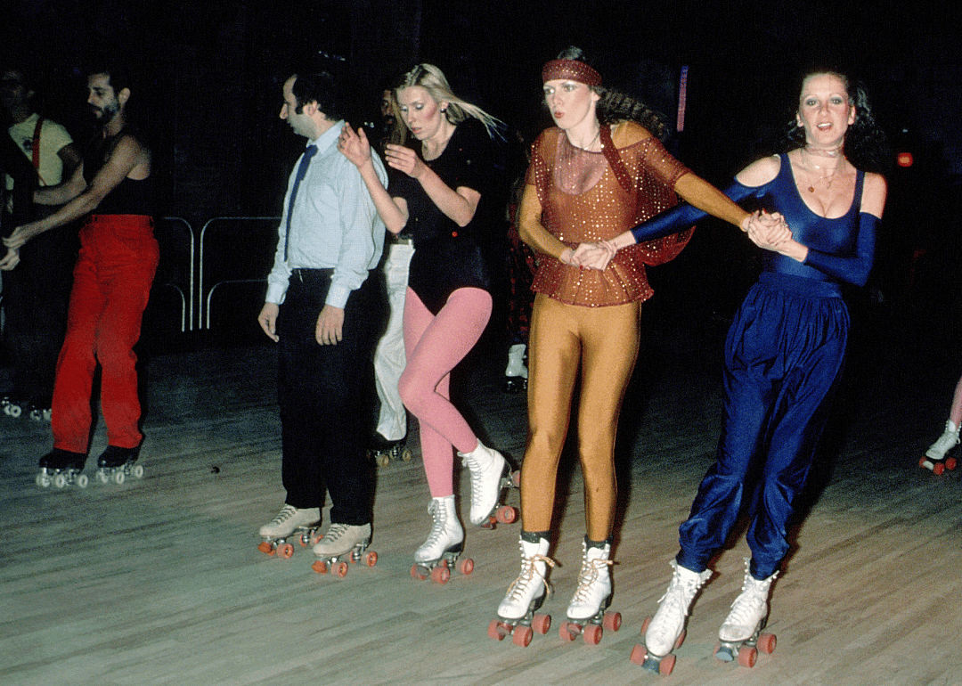 People roller skating indoors.