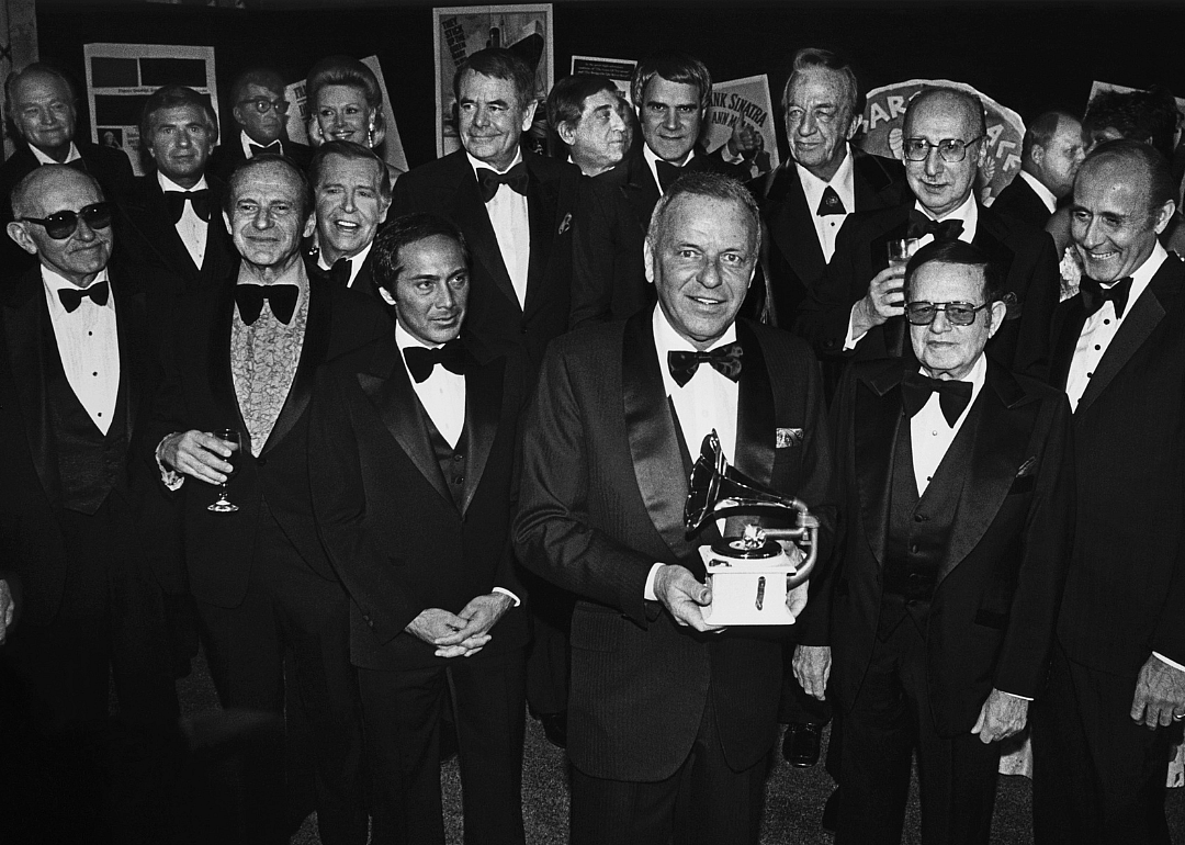 Frank Sinatra holds a Grammy Award as he is honored by celebrity friends at Cesar’s Palace party.