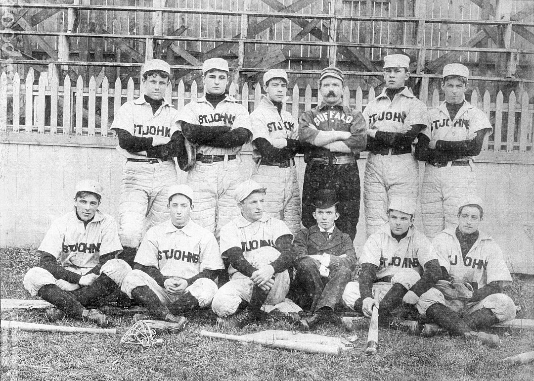 Members of the St John baseball team pose on a field, circa 1895