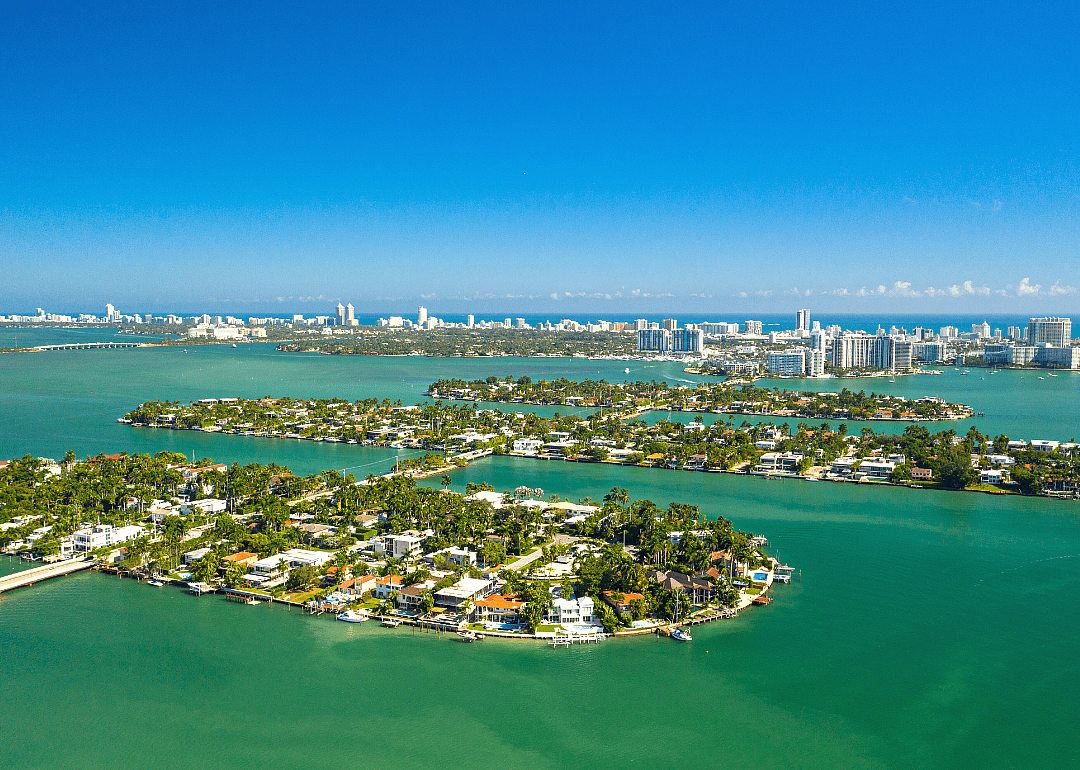Colorful homes on blue waterfront property.