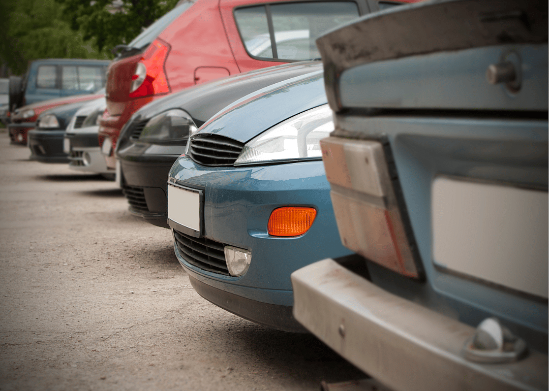 Used cars lined up in a parking lot.
