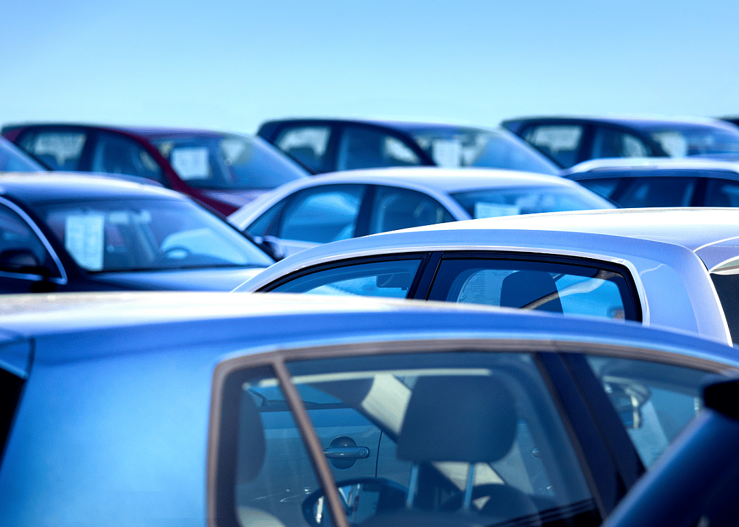 View across the roofs of multiple parked cars.