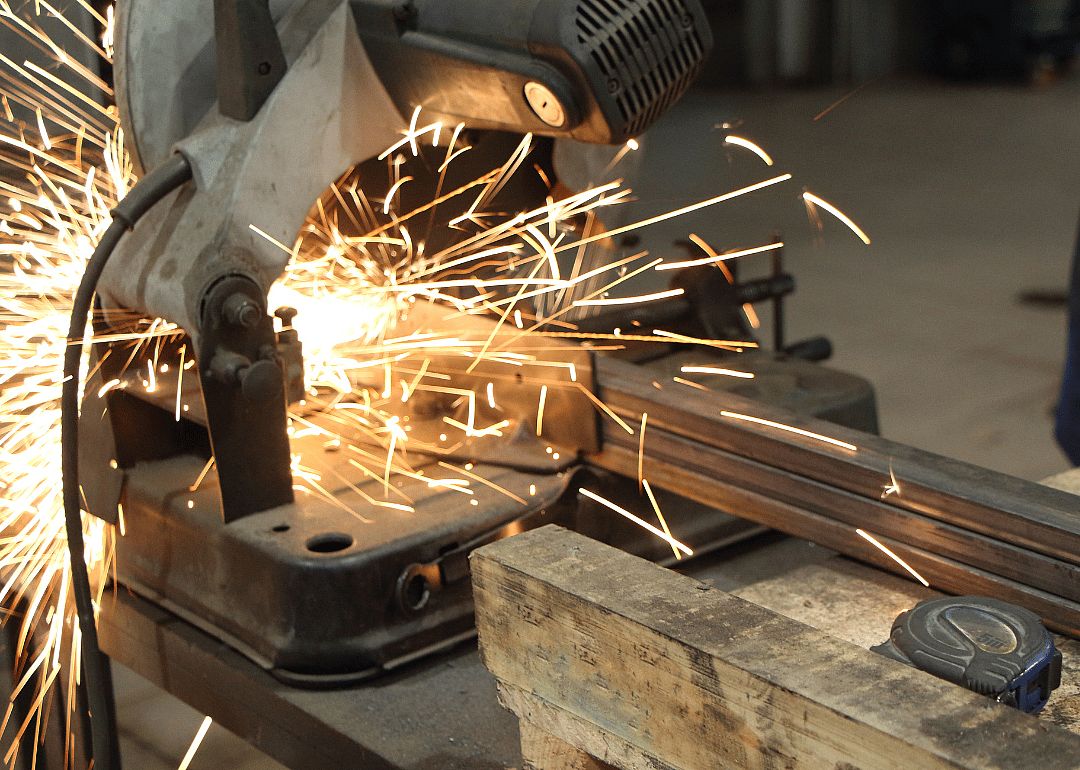 A metal tool is welded in a factory.