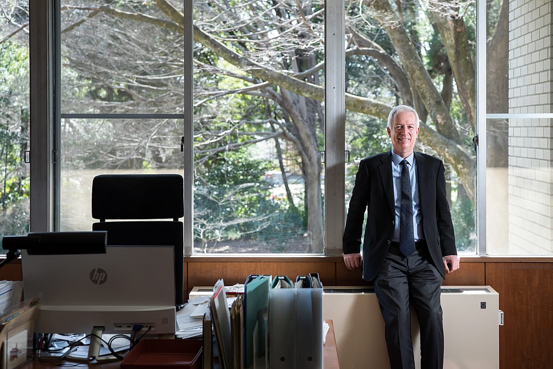 A man stands in an office.