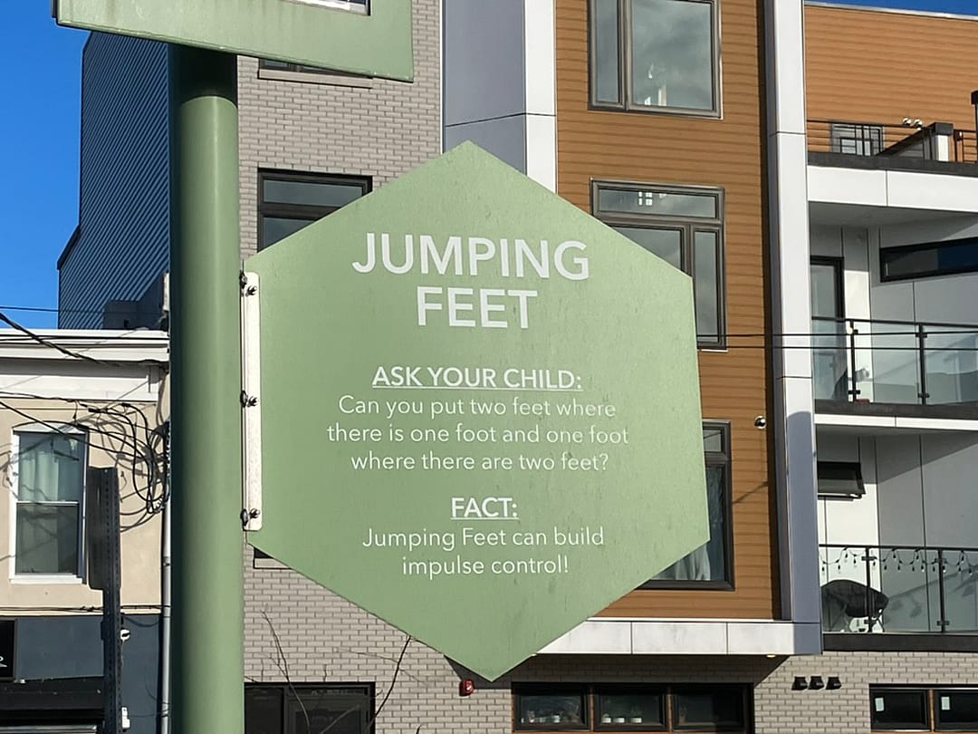 A sign at Philadelphia’s Urban Thinkscape guides players to try an alternate version of hopscotch that promotes executive functioning skills.