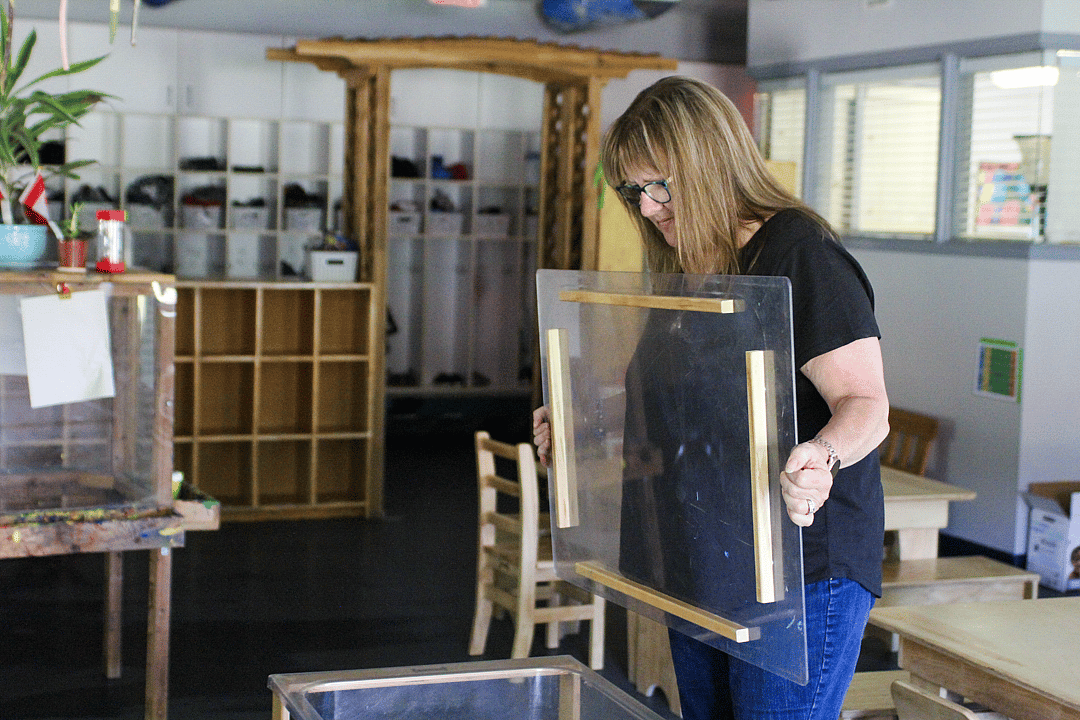 Lorraine Trulsen, owner of the Heritage Park Child Care Centre, prepares materials for children at her program in British Columbia.