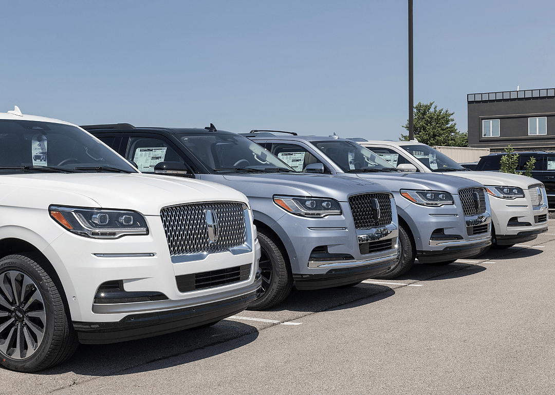 Lincoln Navigator SUVs on display at a dealership. 
