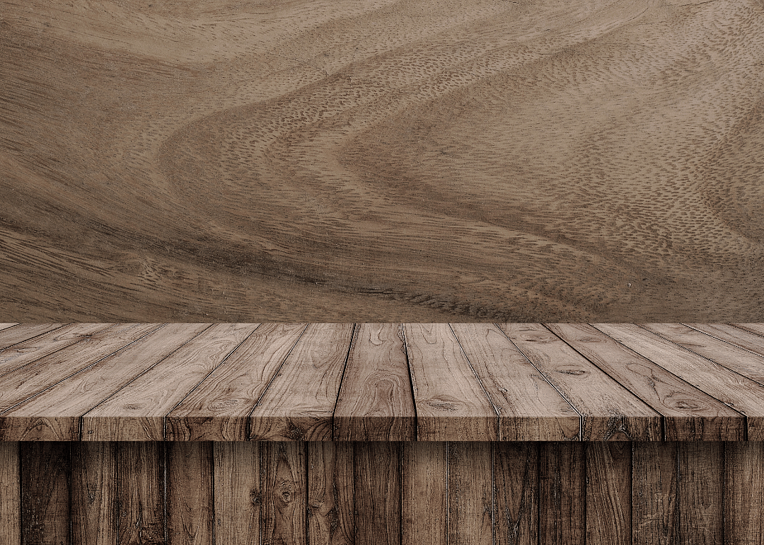 A wooden bench with wood background