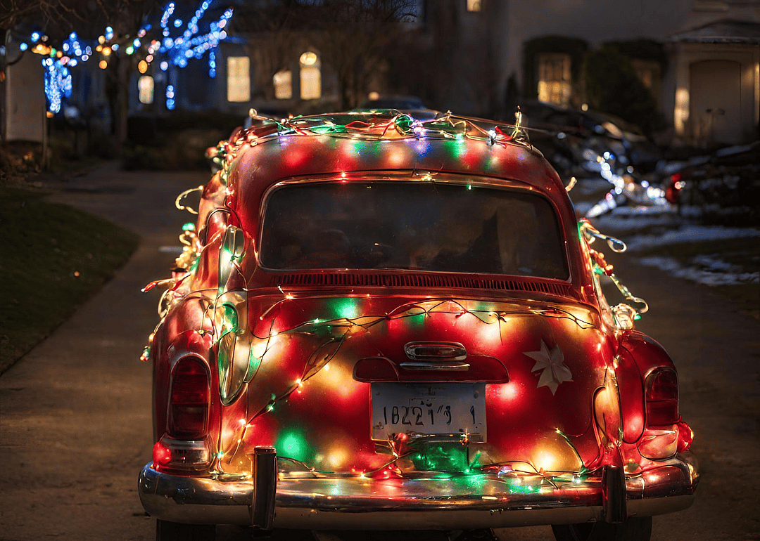 A car covered in LED holidays lights
