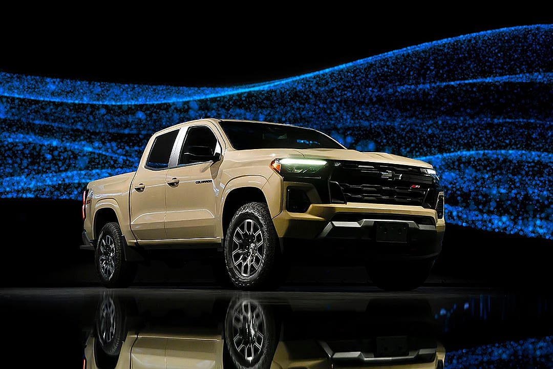 beige Chevrolet Colorado against sparkly background