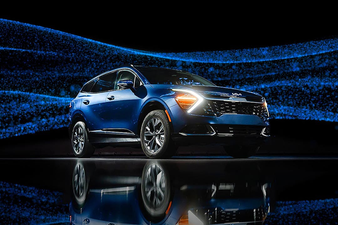 blue kia sportage hybrid against sparkly background