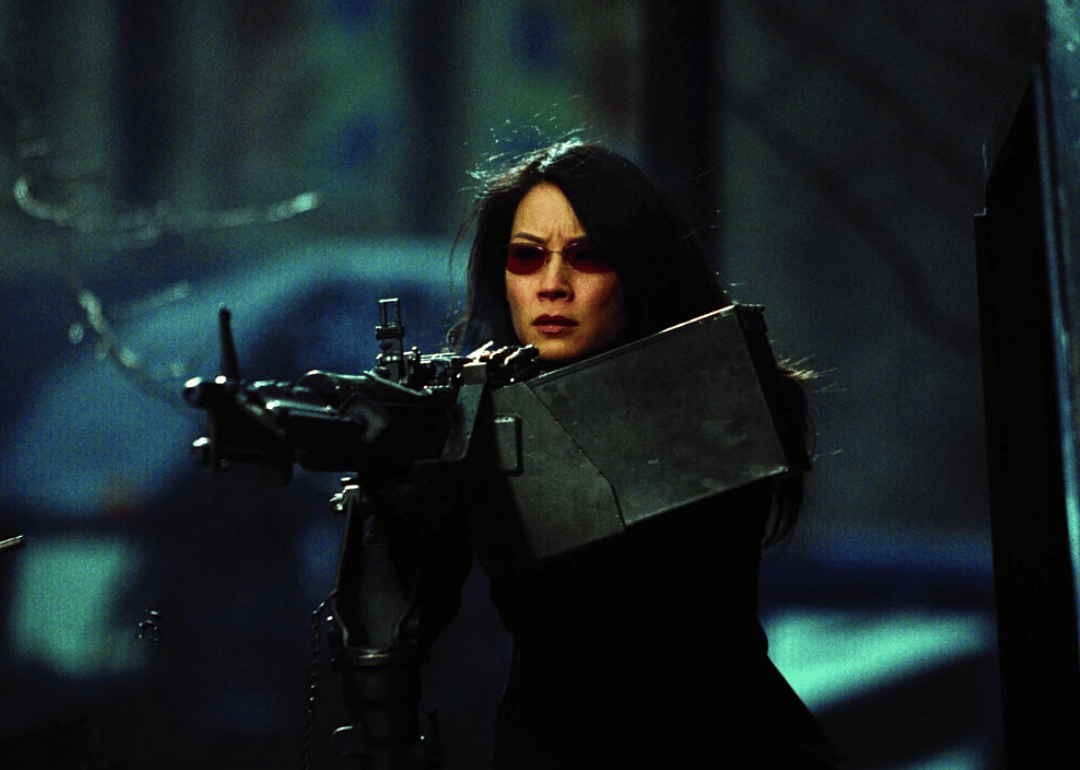 Actor Lucy Liu aiming a large rifle in a scene from 'Ballistic: Ecks vs. Sever'