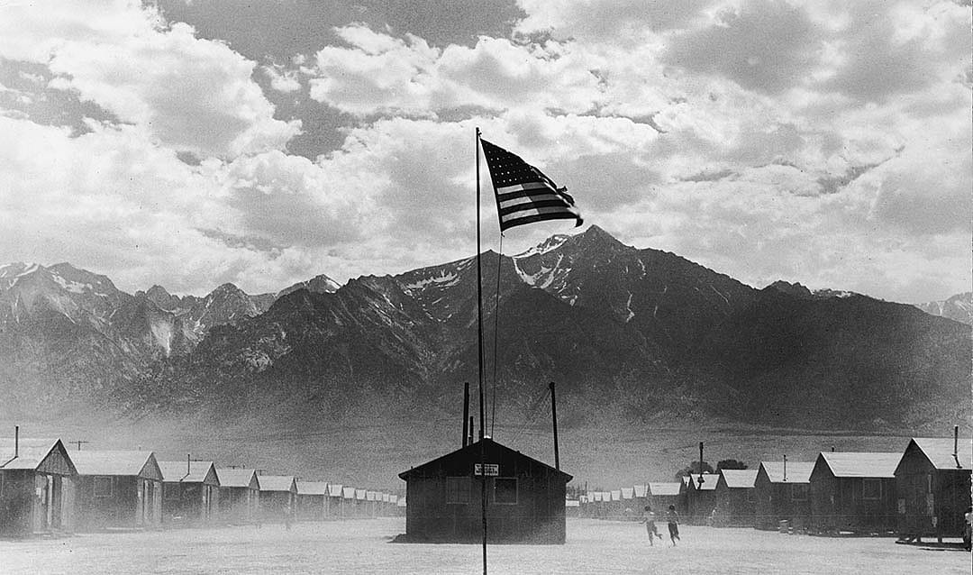 A US flag flies at the Manzanar War Relocation Center, a Japanese-American internment camp, in Manzanar, California, World War II, 3rd July 1942 site of a detention facility for some of the 120,000 Japanese Americans.