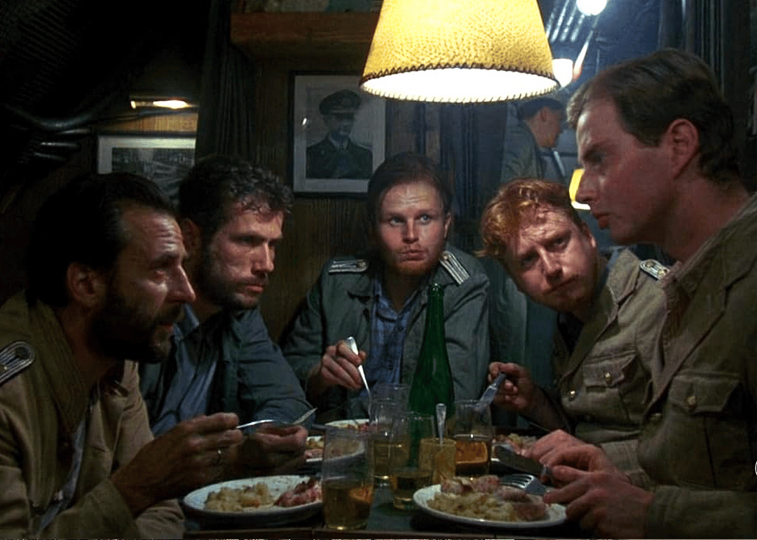Crew members of a German U-Boat in serious discussion while dining.