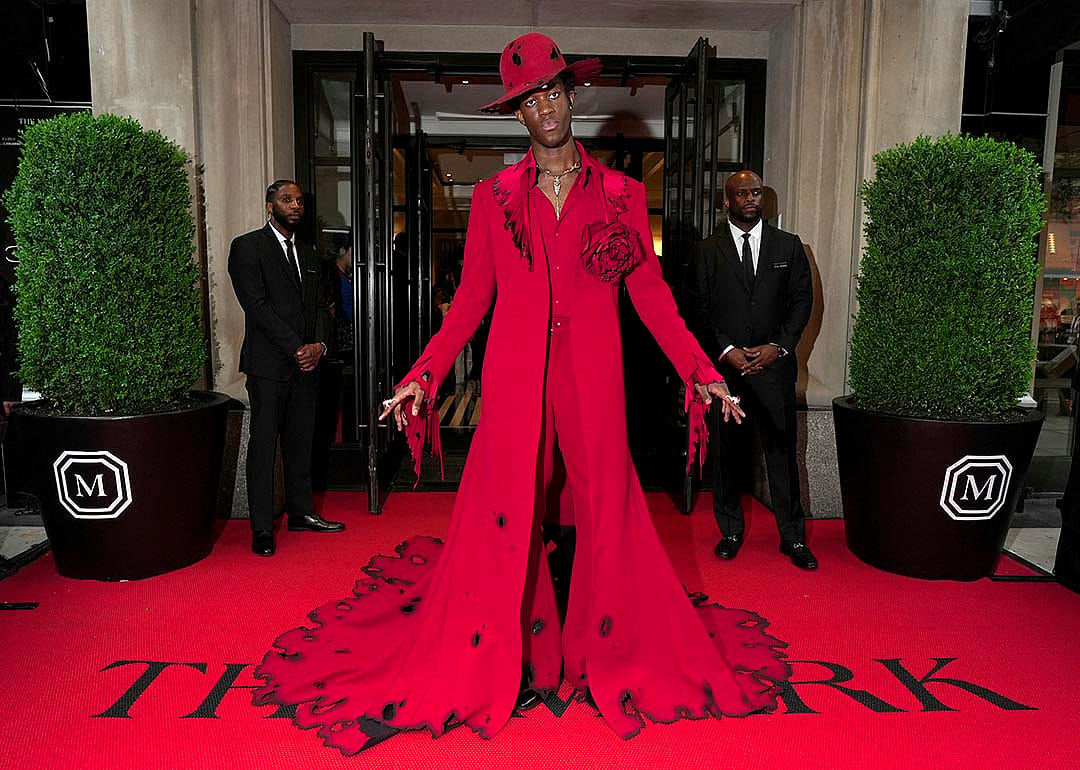Wisdom Kaye wearing all red departs The Mark Hotel for 2024 Met Gala on May 06, 2024