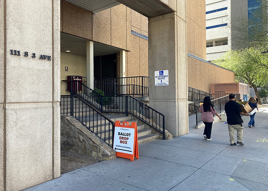 A sign directs voters to the Maricopa County Recorder's Office in downtown Phoenix where they can drop off their ballot in a secure ballot drop box during the March presidential preference election.