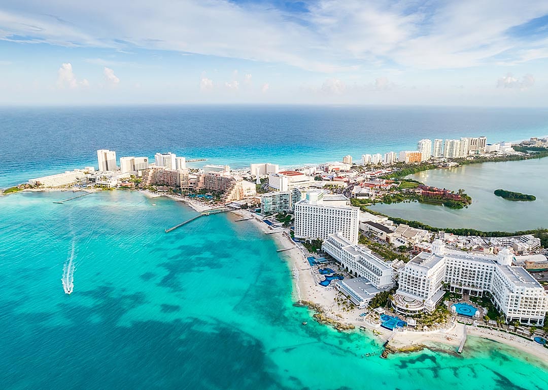 Aerial view of Cancun resort area with blue green ocean.