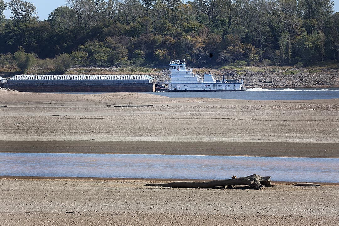 Barges are pushed up the Mississippi River near Portageville, Missouri. Lack of rain in the Ohio River Valley and along the Upper Mississippi has caused the Mississippi River south of the confluence of the Ohio River to reach near record low levels.