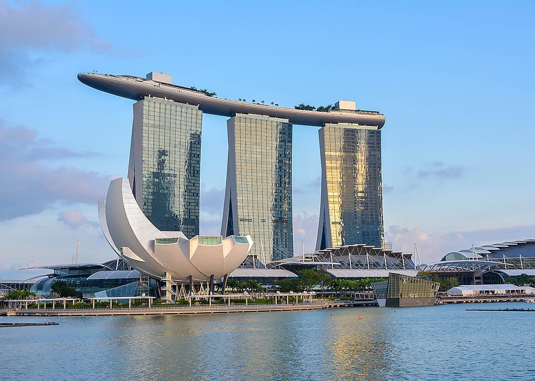 View at the Marina Bay in Singapore during the afternoon with the iconic landmarks of The Helix Bridge.