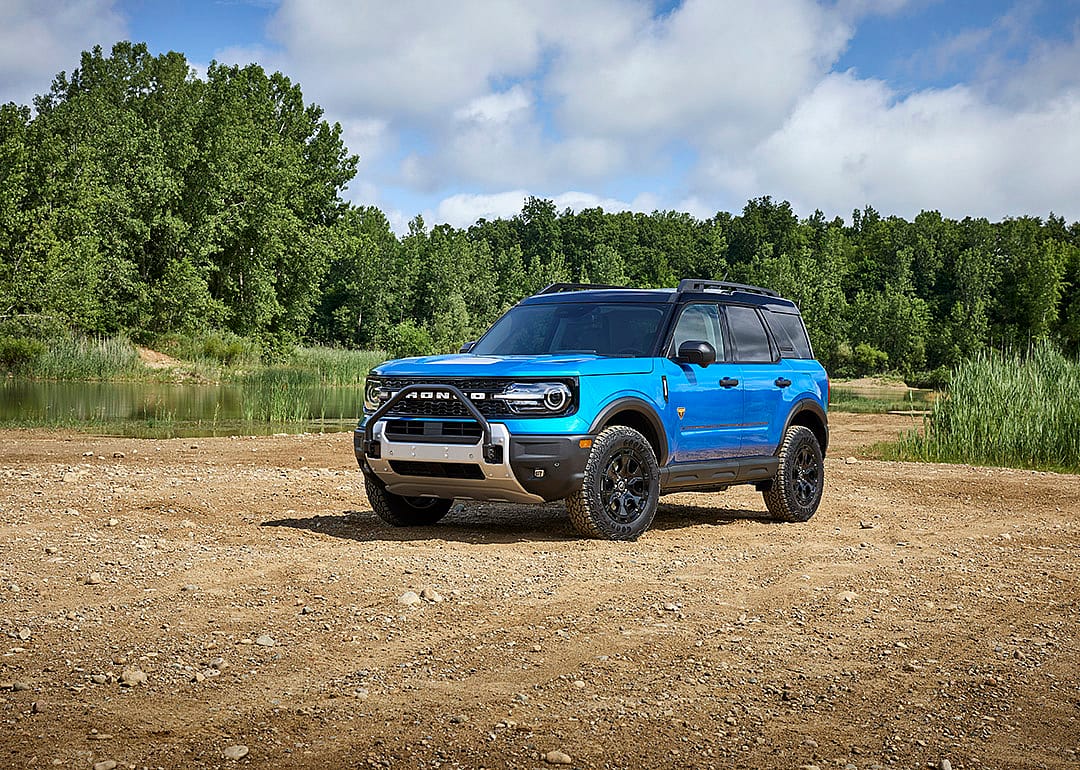 A blue 2025 Ford Bronco Sport parked on a rocky road.