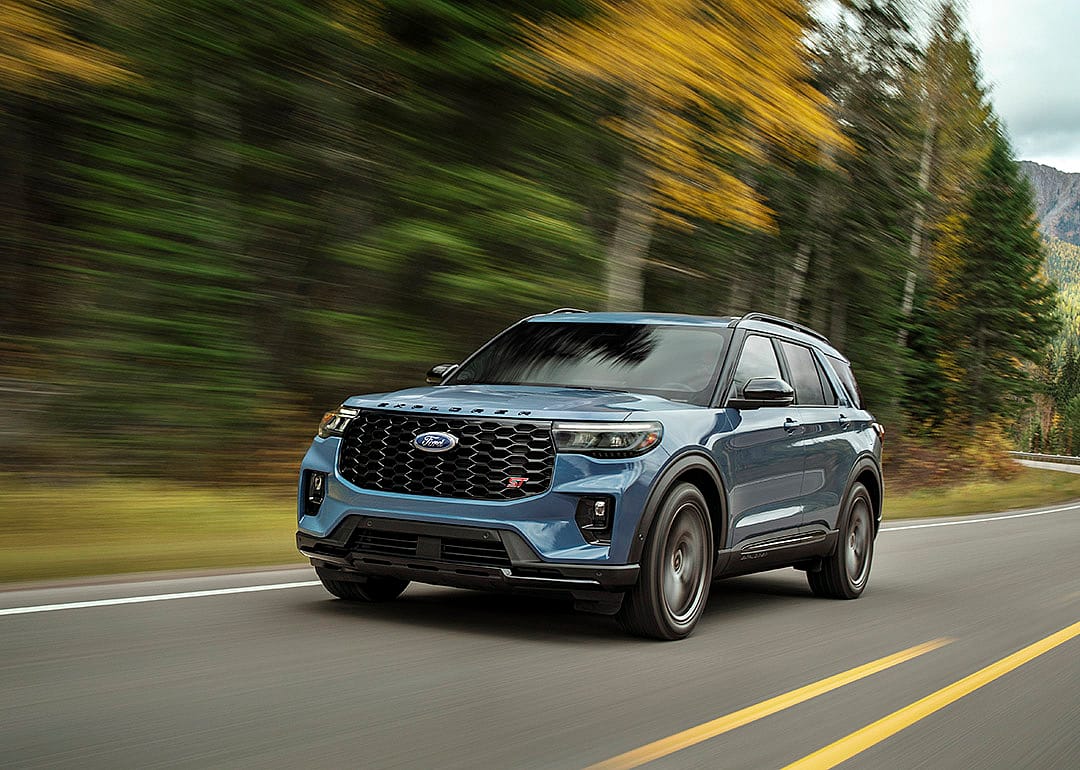 A blue 2025 Ford Explorer on the road.
