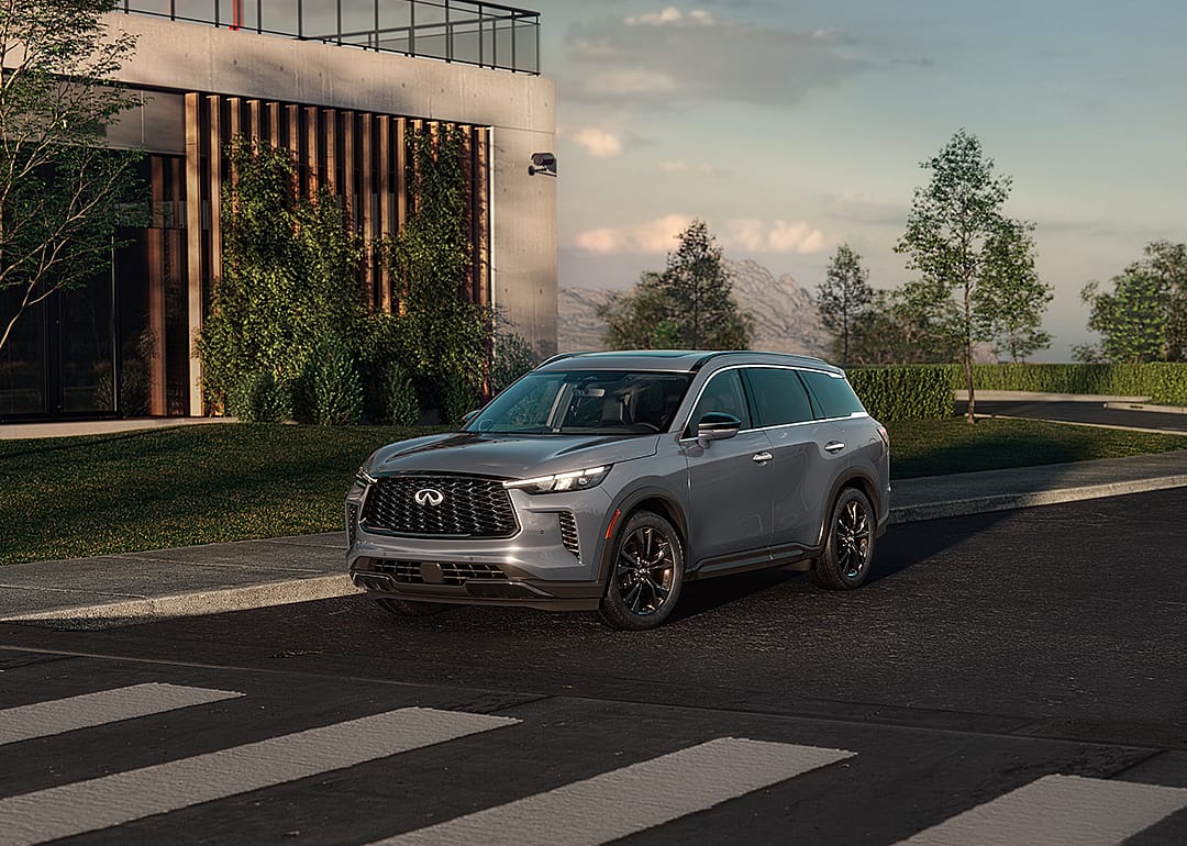 Gray Infiniti QX60 driving on the road.