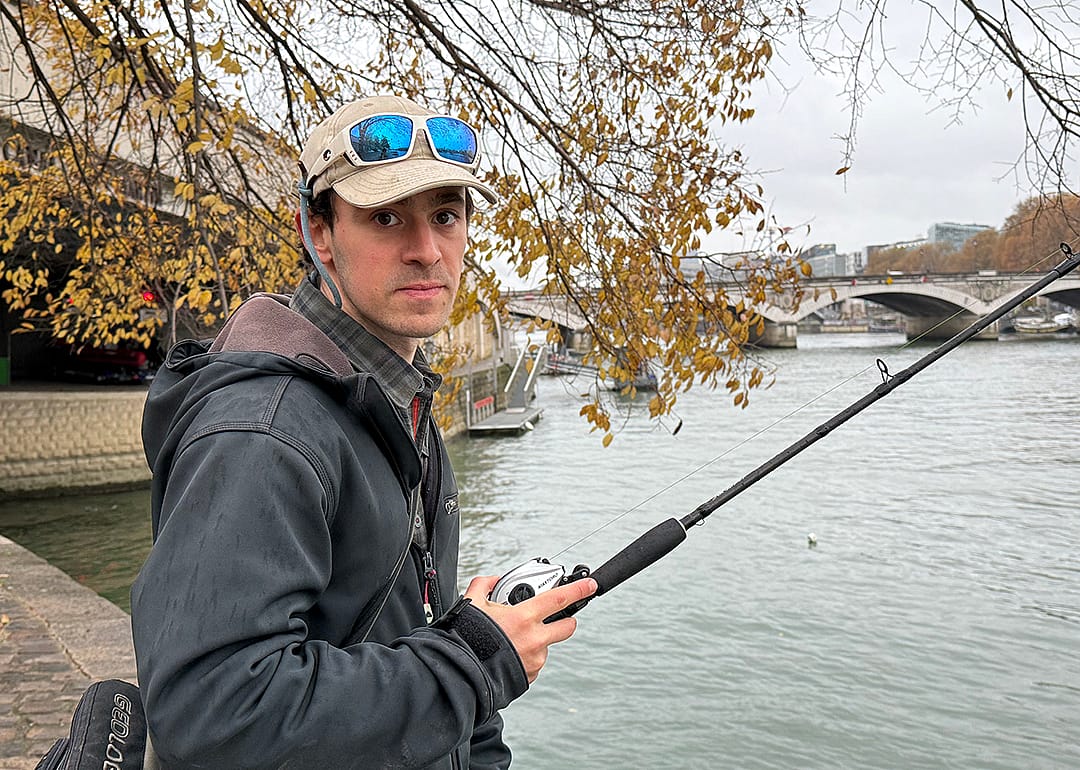 Bill François photographed fishing by the river Seine.
