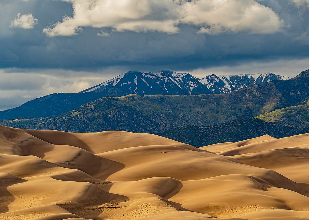 A sunny view of the Great Sand Dunes landscape at the National Park and Preserve in Colorado.