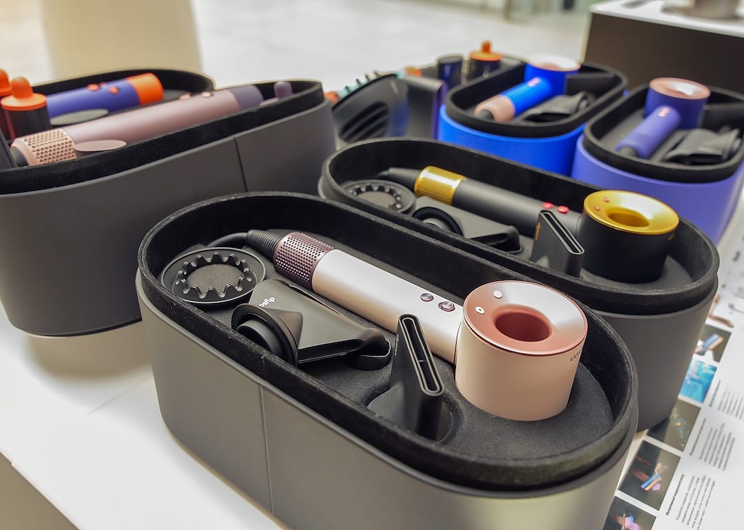 New Dyson hair dryers on display in a store.