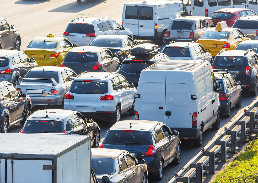 Cars stopped in traffic on highway.