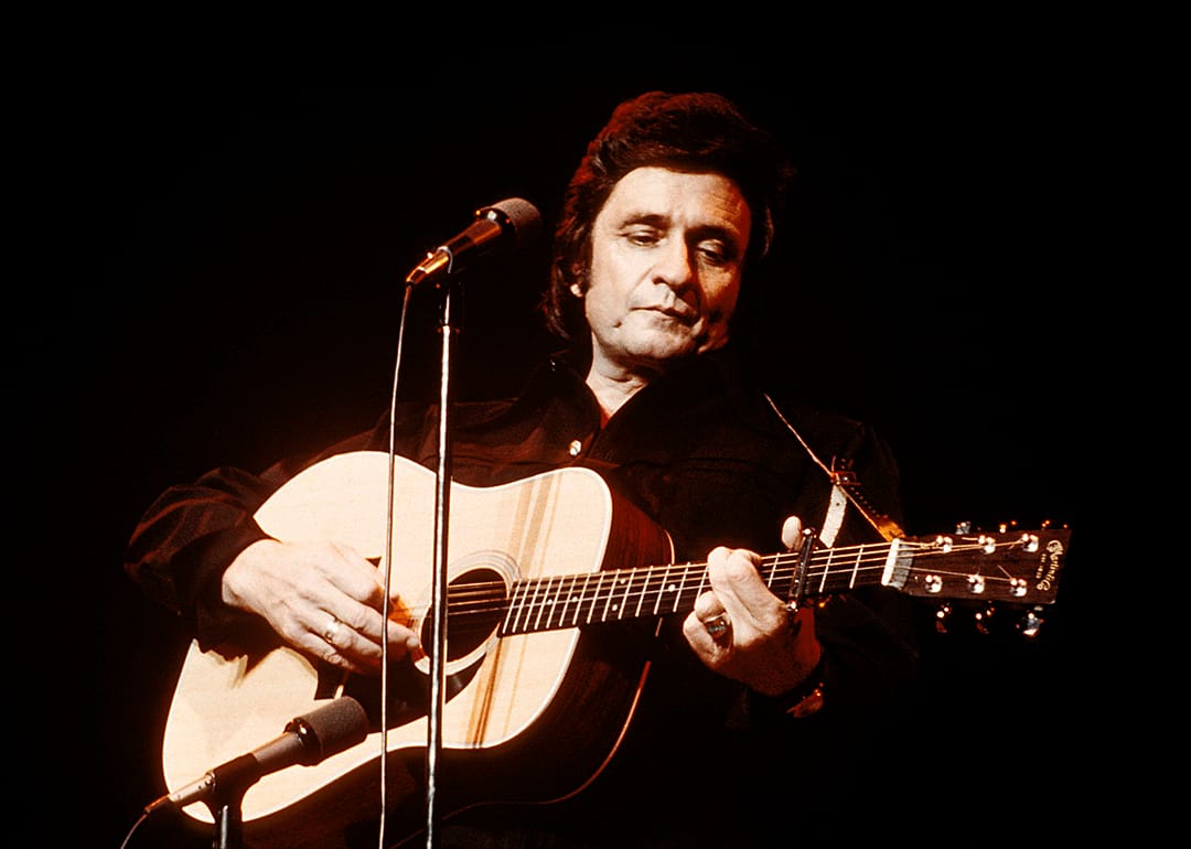 Johnny Cash performing onstage.