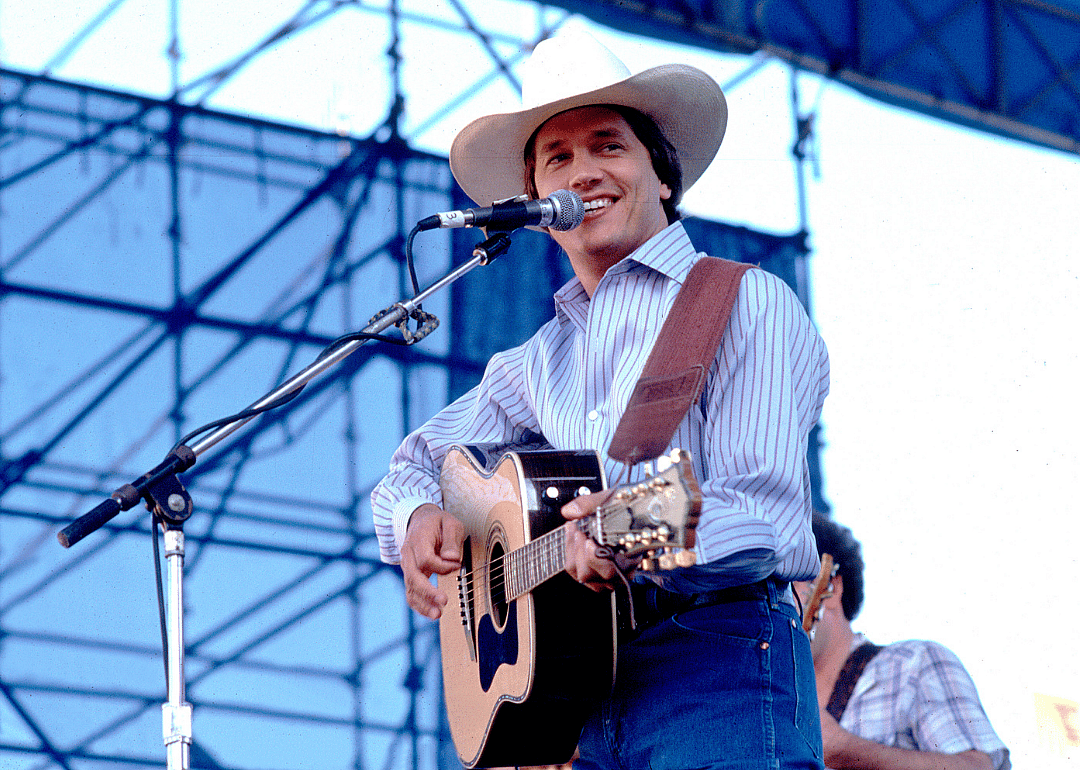 George Strait performing onstage.