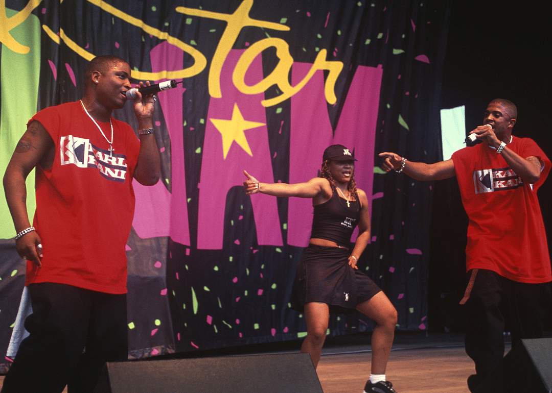 Robert Huggar and Raphael Brown of Next perform on stage.