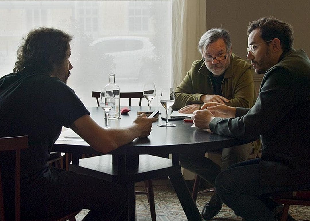 Three men seated at table in ‘Menus-Plaisirs - Les Troisgros’.