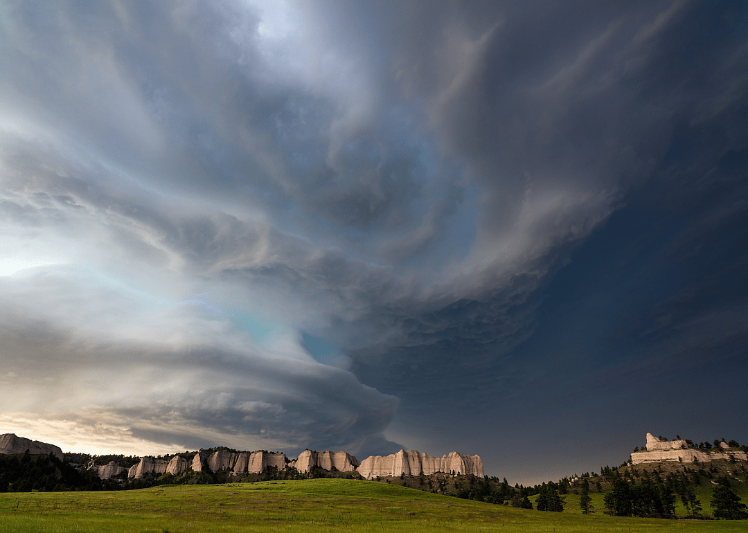 Supercell storm over landscape.