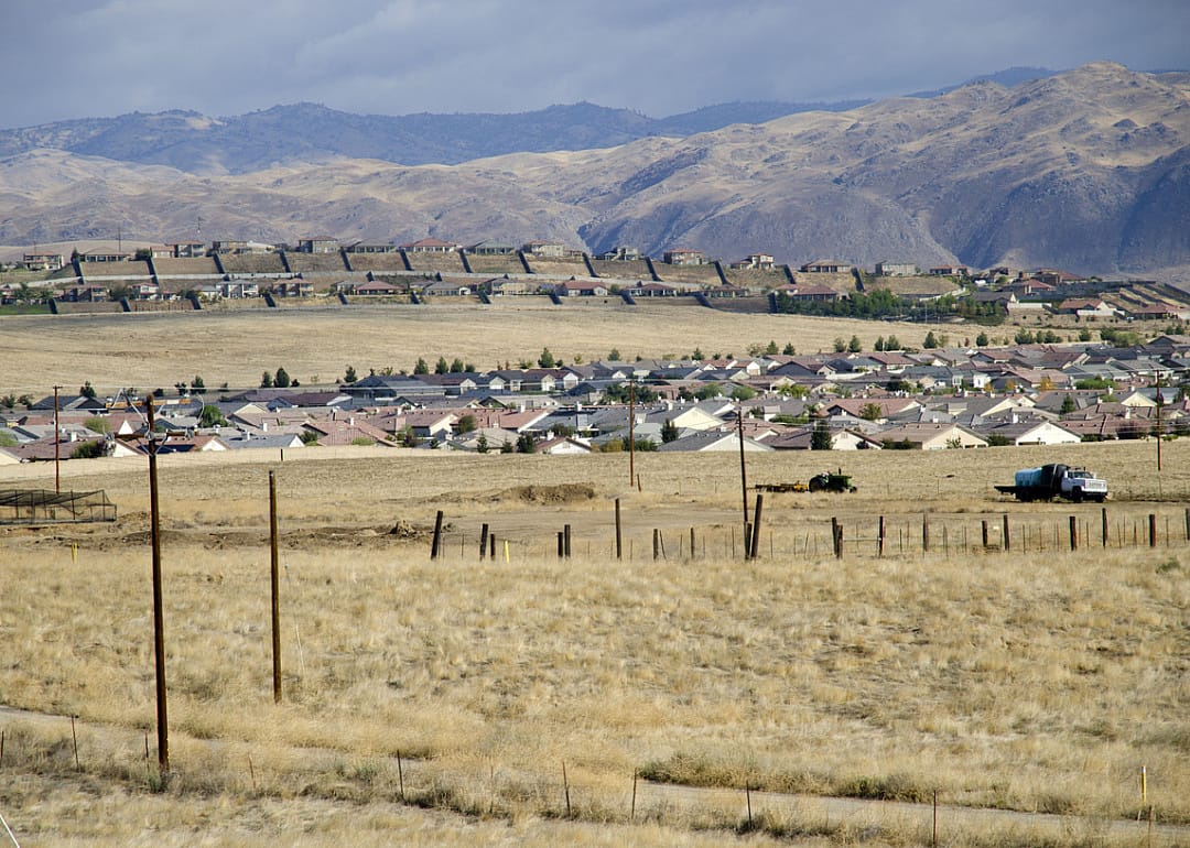 New residential housing developments against the Sierra Nevada foothills.