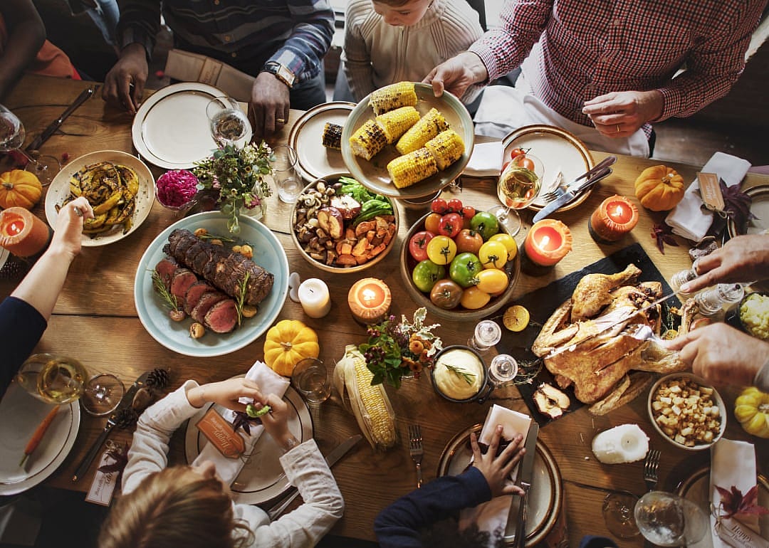 People seated around Thanksgiving table.
