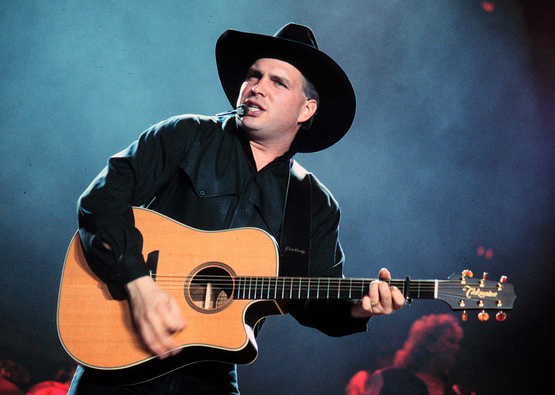 Garth Brooks performing onstage.