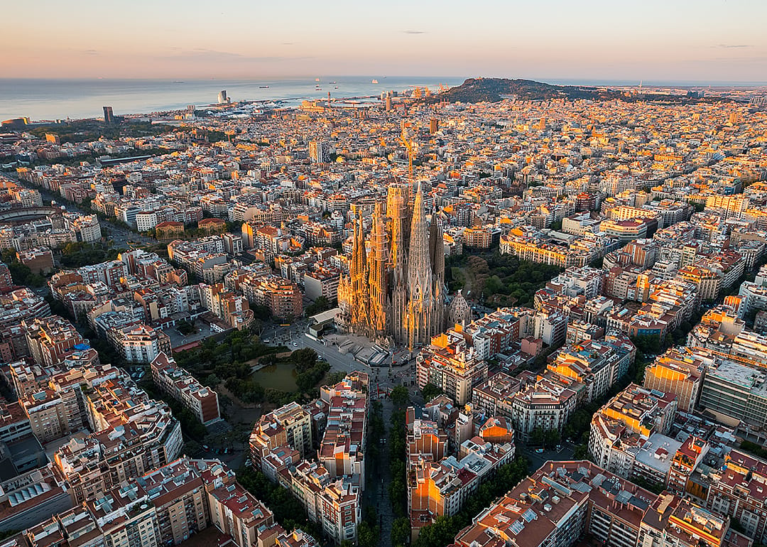 Aerial view of Barcelona with Sagrada Familia Basilica at sunrise.